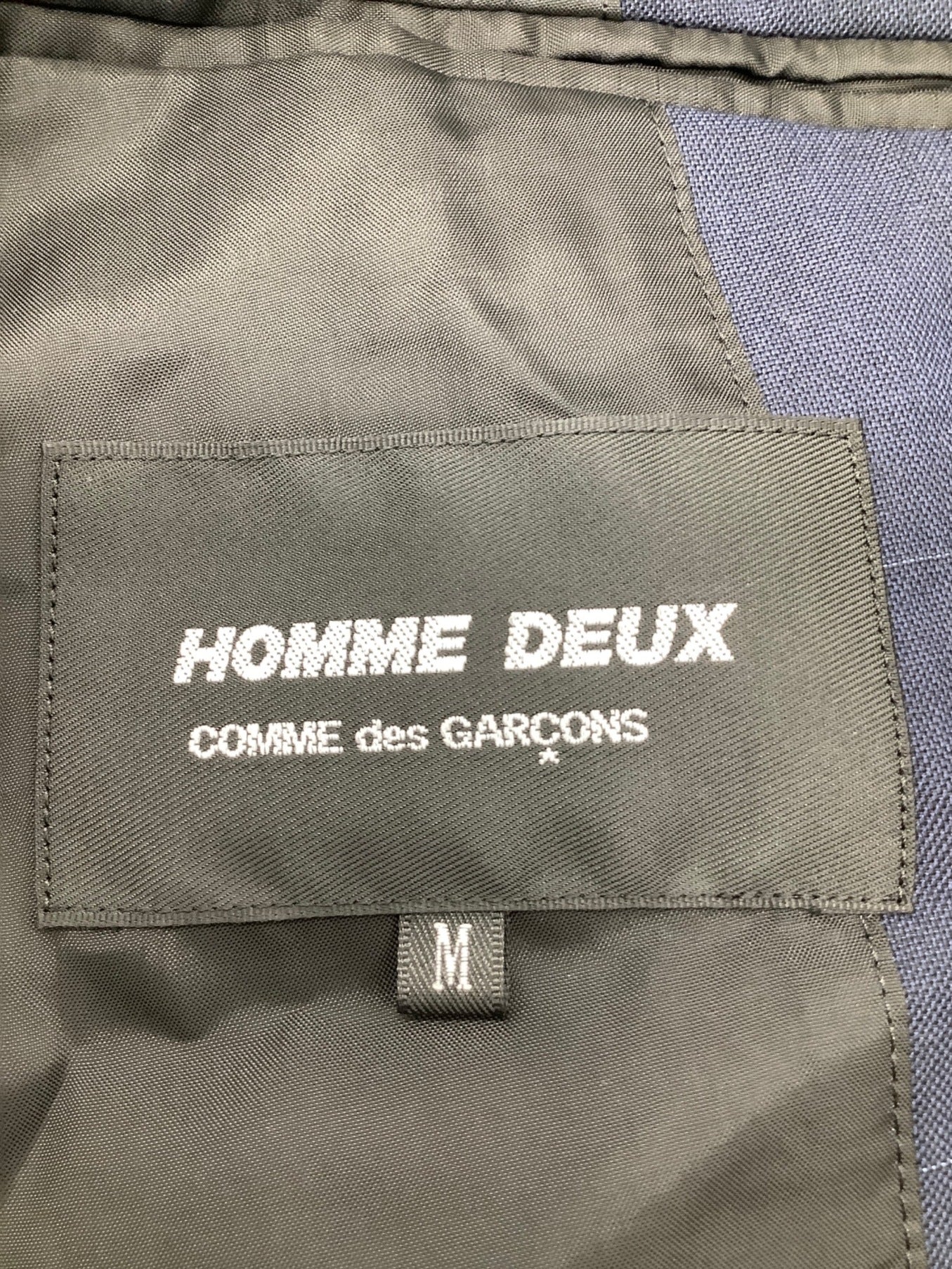 Comme des Garcons homme deux แจ็คเก็ตที่มีวัสดุที่แตกต่างกัน de-j037