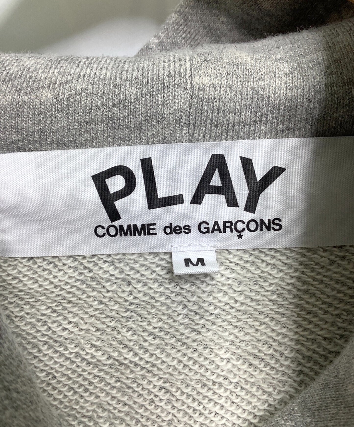 播放Comme des Garcons連帽運動衫AE-T104 AD2020