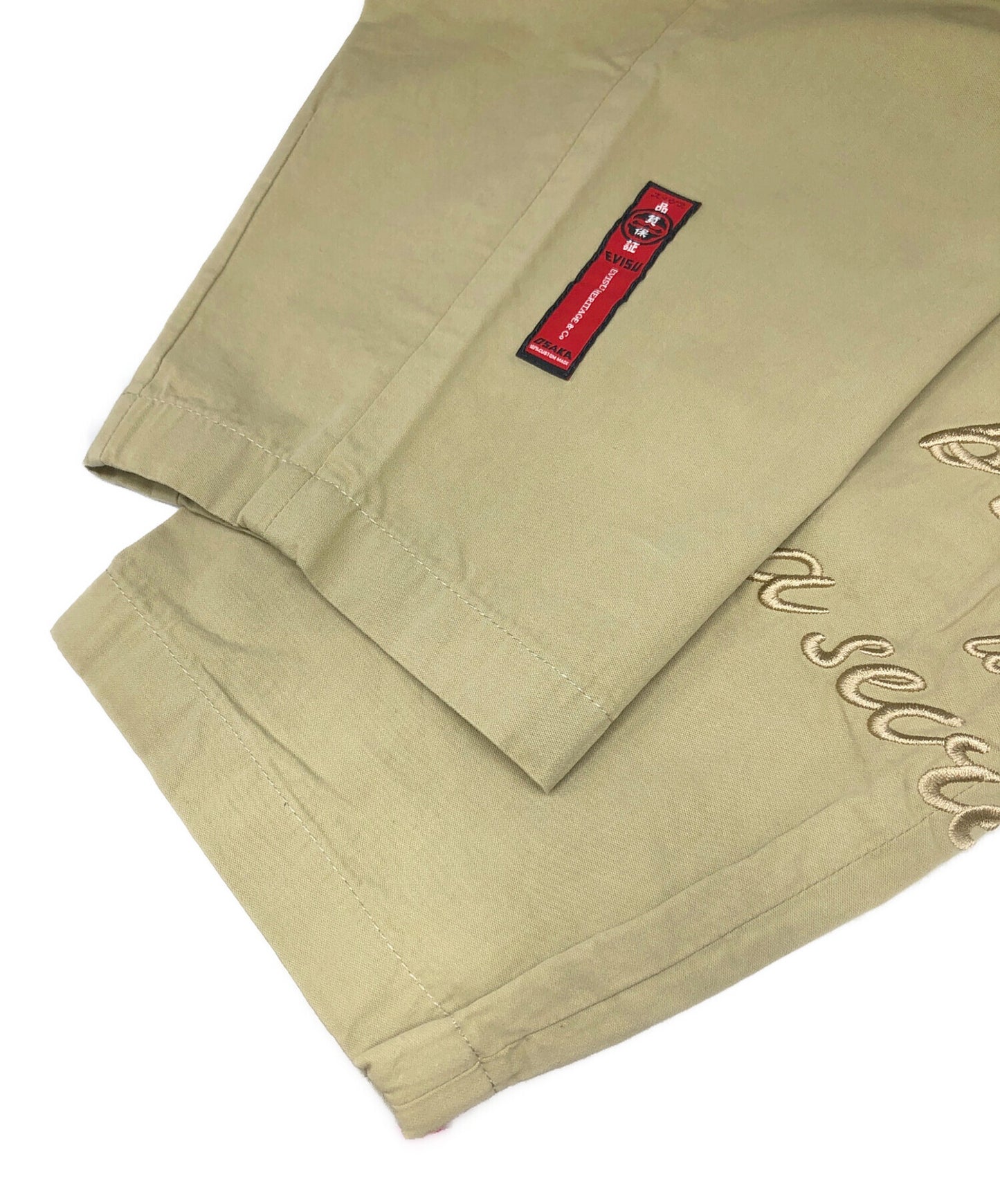 [Pre-owned] EVISU Loose-Fit Pants with Family Crest and Slogan Embroidery