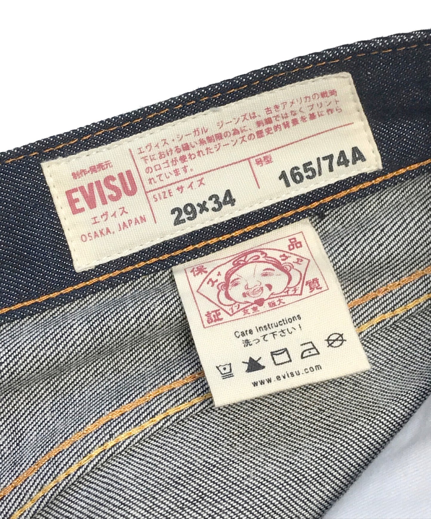 [Pre-owned] EVISU Carrot-fit Denim Jeans with Allover Daruma Daicock Print