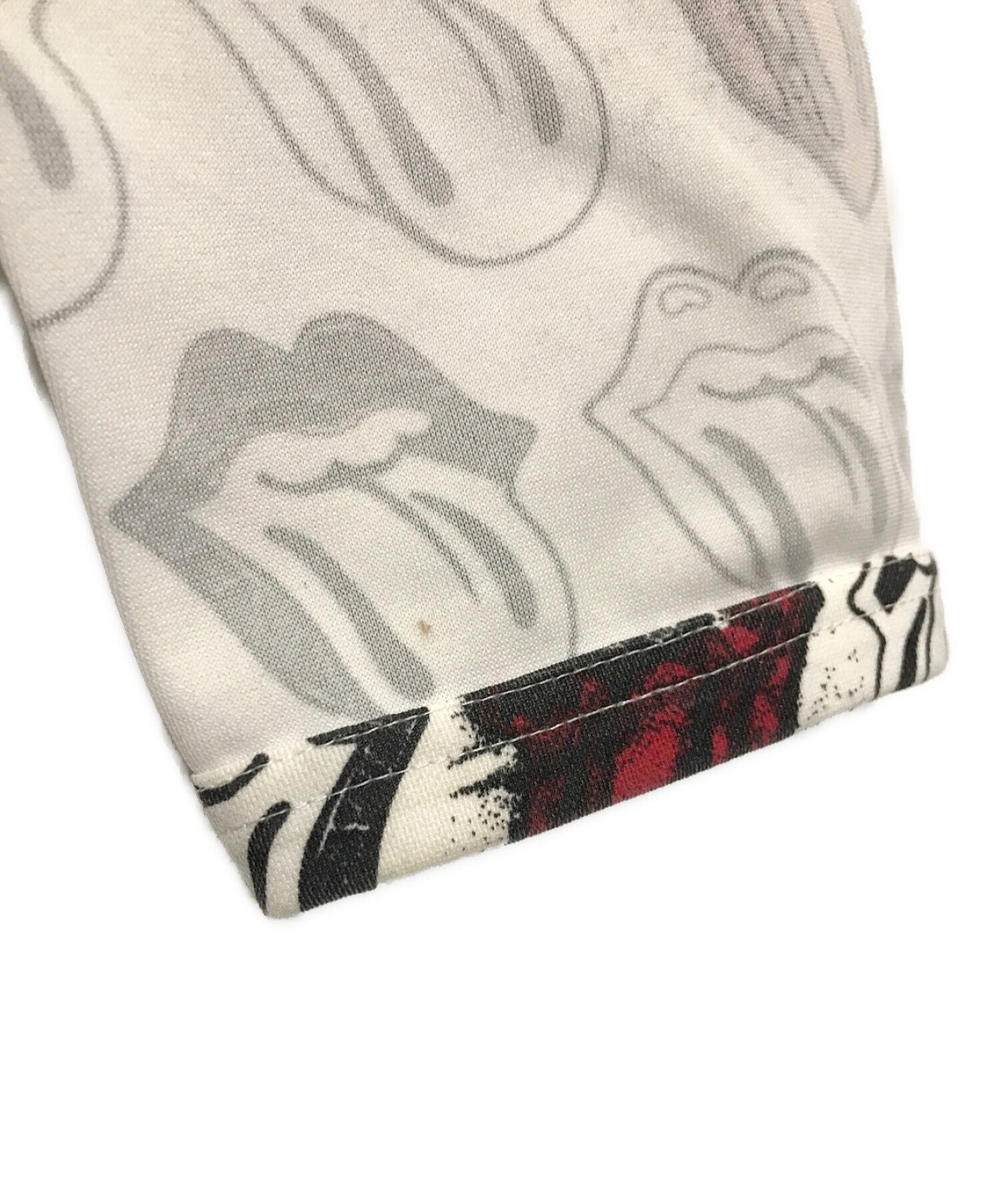 COMME des GARCONS HOMME PLUS Rip and tan all-over print cut and sewn PQ-T001