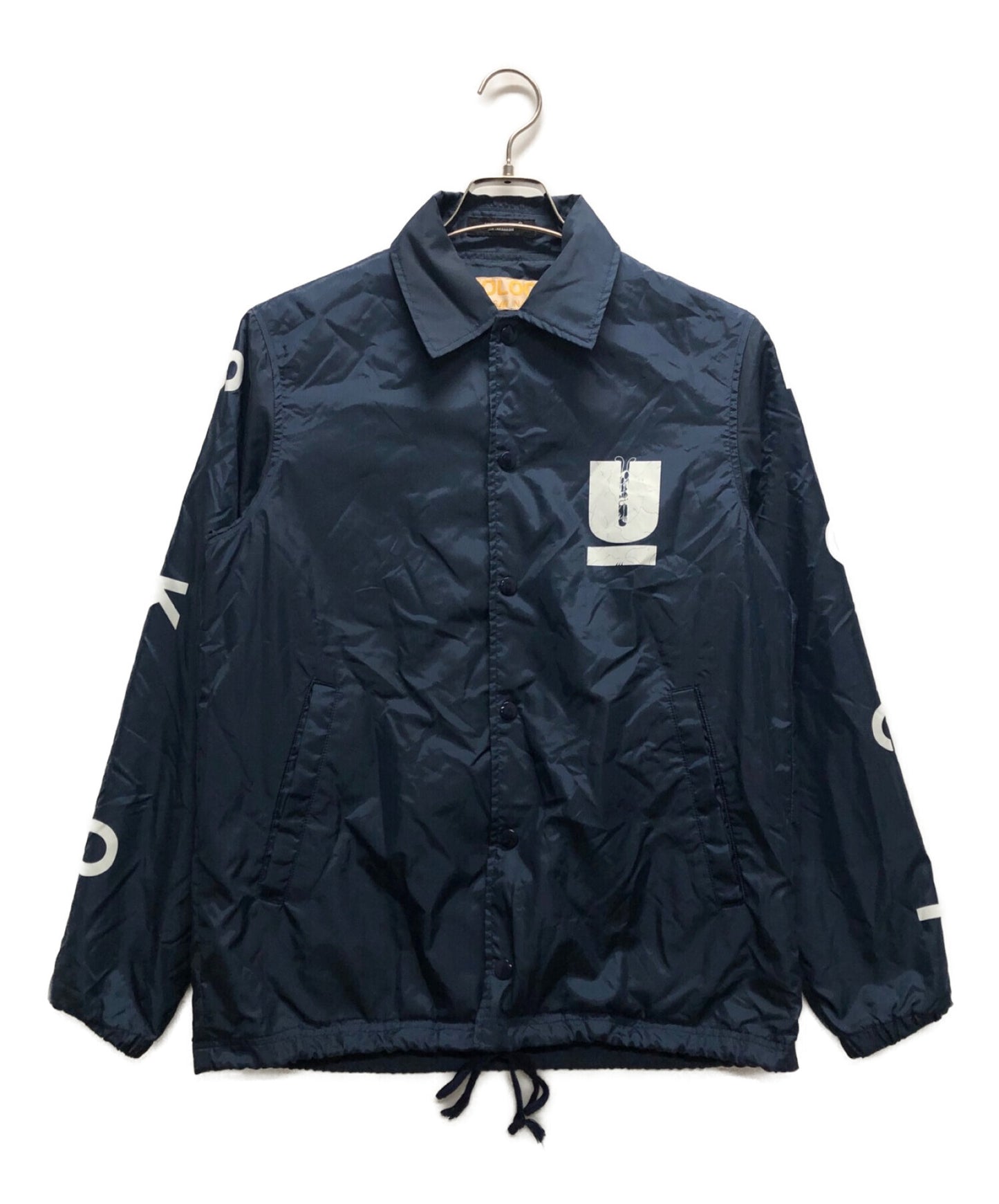 臥底×Skoloct 20SS背部印刷教練夾克UCT9207。